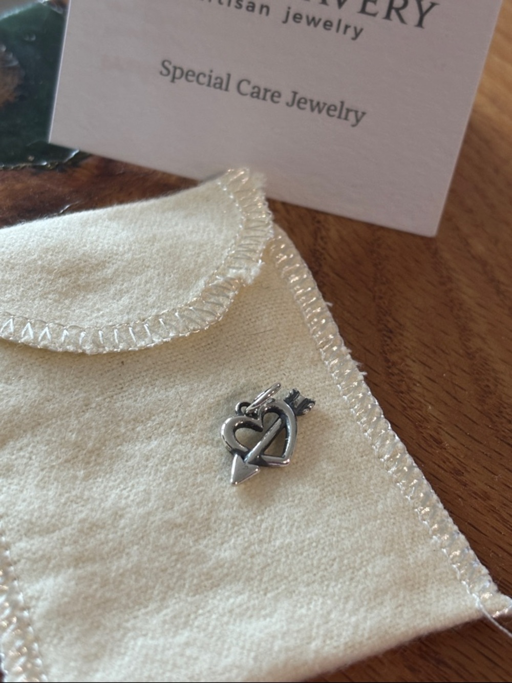 Retired Love’s arrow charm new never worn with dust bag!